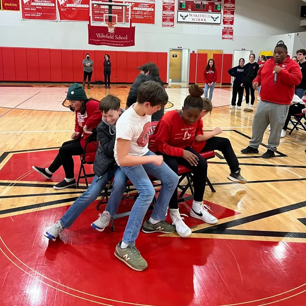students playing musical chairs