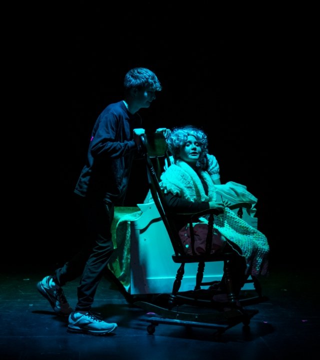 student stagehand and actor on stage